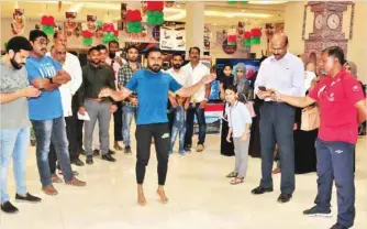  ??  ?? Mohammed Ali, a salesman with an FMCG firm in the capital area, performed 57 ‘jumping jacks’ in 30 seconds in the presence of a large gathering and Guinness evaluators at Nesto Hypermarke­t in Wadi Kabir.