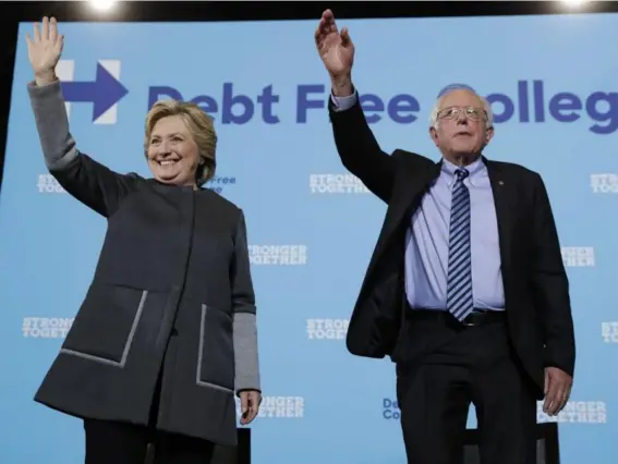  ??  ?? Hillary Clinton and Bernie Sanders at the University Of New Hampshire in Durham yesterday (AP)