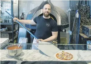  ??  ?? St. Albert’s Matteo Cesarotto was crowned top Canadian pizza maker of the year at the Canadian Pizza Show in Mississaug­a, Ont., last week.