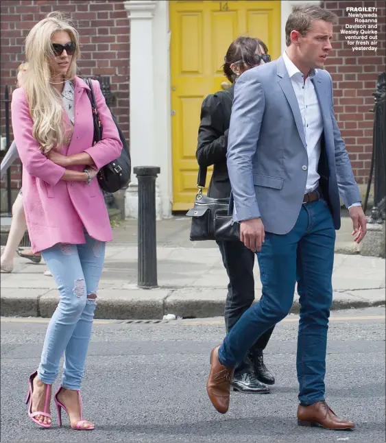  ??  ?? fragile?: Newlyweds
Rosanna Davison and Wesley Quirke ventured out for fresh air
yesterday