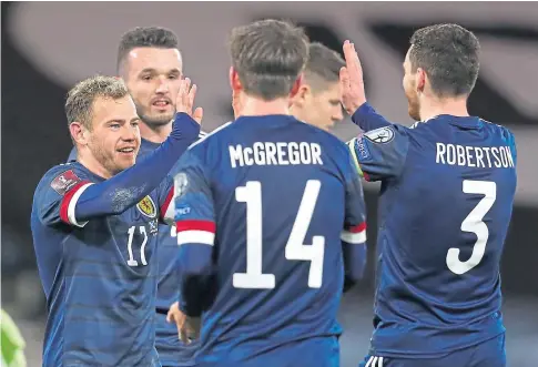  ??  ?? HIGH FIVES: Scotland can be reasonably happy with their position after the opening three group games.