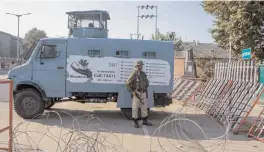  ?? — PTI ?? A security person stands guard outside the Civil Secretriat during Darbar move or shifting of government offices from Srinagar to Jammu at the Civil Secretriat in Srinagar on Saturday.