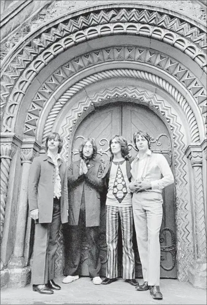  ?? Stephen Goldblat ©Apple Corps Ltd. ?? THE BEATLES pose in front of London’s St. Pancras Old Church in July 1968, near the band’s famed Abbey Road Studios.