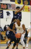  ?? OWEN MCCUE - MEDIANEWS GROUP ?? Perkiomen School’s Josh Odunowo (4) looks toward the basket Wednesday against Mt. Zion Prep.