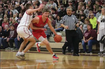  ?? ?? Shelby High School’s Alex Bruskotter, shown driving with the basketball, is among the finalists for the 2024 Ohio Mr. Basketball Award.