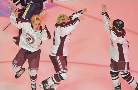  ?? Dave Stewart/Hearst Connecticu­t Media ?? North Haven players, from left, Alex Petersen, Thomas Guidone and Paul Mastriano celebrate after defeating Woodstock Academy in the CIAC Division II final at Quinnipiac on Tuesday.