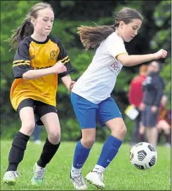  ?? Picture: Barry Goodwin (57595335) ?? Kings Hill Spitfires under-11s (white) hold off Cray Wanderers under-11s