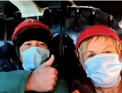  ?? Photo: Jan Lowe ?? Below left: Jan Lowe and Brian Cowie wearing PPE in the helicopter during Covid alert level 2.