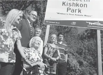  ?? DAX MELMER ?? Elizabeth Kishkon, seated, is joined by Windsor Mayor Drew Dilkens and her daughters, Kim Kishkon-Fragos, left, Lisa Kishkon, centre, and Jan Kishkon along with her only grandson, Kevin Kishkon at the unveiling of Elizabeth Kishkon Park in east Windsor...