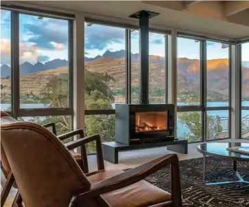  ??  ?? 20 18 Bay vistas at Matakauri Lodge 19 Night time activities around Helena Bay’s firepit © Chris McLennan 20 The famous windows at The Rees Hotel 21 The Lodge at Kauri Cliffs