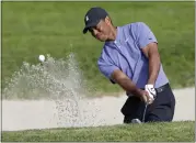  ?? ALEX GALLARDO — THE ASSOCIATED PRESS ?? Tiger Woods, on his way to a 3-under 69, plays from a bunker on the eighth hole at Torrey Pines on Thursday.