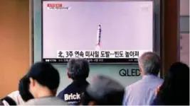  ?? REUTERSPIX ?? People watch a news report on North Korea’s firing of what appeared to be a short-range ballistic missile at a railway station in Seoul yesterday.