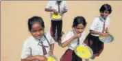  ?? HT FILE PHOTO ?? The midday meal scheme was introduced to enhance enrolment, and improve nutritiona­l levels among children.