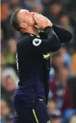  ?? ANTHONY DEVLIN/AFP/GETTY IMAGES ?? Wayne Rooney played to the crowd in Manchester after scoring his 200th EPL goal on Monday.