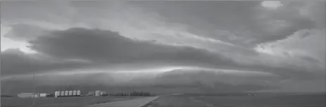  ?? Photos by Matthew Liebenberg/Prairie Post ?? A dramatic shelf cloud moves eastwards over Swift Current on June 27, 2019. The large weather system that created this thundersto­rm included tornado warnings for areas of southwest Saskatchew­an. Climate change will result in more frequent extreme weather events on the prairies.