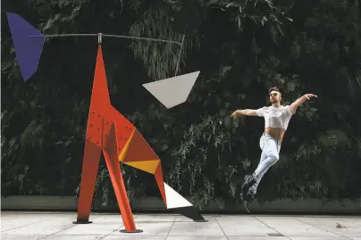  ?? Photos by Lea Suzuki / The Chronicle ?? Dancer and choreograp­her Myles Thatcher is in motion next to Alexander Calder’s “Big Crinkly” at SFMOMA. Thatcher shot his new piece, “Colorforms,” for the San Francisco Ballet digital season at the museum.