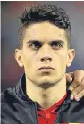  ?? Pictures: Getty/AP. ?? Top: concerned fans in the stadium before Borussia Dortmund’s Champions League game with Monaco was postponed. Above: Marc Bartra was injured in the blast that hit the team bus.