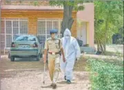  ?? PTI ?? An ED official wearing a PPE suit raids the farmhouse and residence of Agrasain Gehlot, brother of CM Ashok Gehlot.