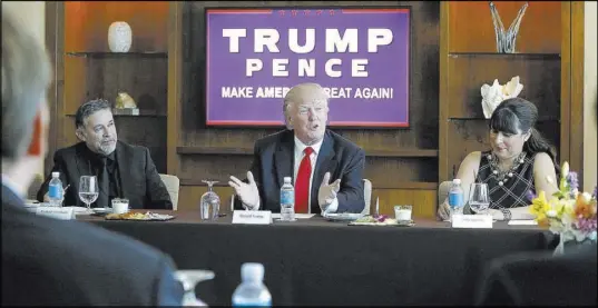  ?? Gerald Herbert The Associated Press file ?? Pastor Pasqual Urrabazo, left, sits with Republican presidenti­al candidate Donald Trump at a Las Vegas roundtable in 2016.