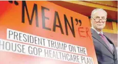  ?? — Reuters ?? Senate Minority leader Chuck Schumer appears at a press conference with a sign that he had personally edited to read “Mean-er” after Senate Republican­s unveiled their version of legislatio­n that would replace Obamacare on Capitol Hill in Washington.