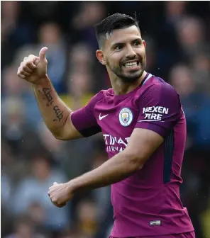  ?? EPA ?? Sergio Aguero helped keep Manchester City on a roll as he scored three times in a 6-0 thrashing of Watford yesterday at Vicarage Road