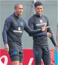  ??  ?? Marcus Rashford with Ashley Young at training