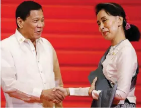  ??  ?? Philippine President Rodrigo Duterte, left, with Myanmar’s State Counsellor Aung San Suu Kyi.