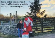  ??  ?? Santa gets a helping hand from Eva Martindale to switch on Coll’s Christmas lights