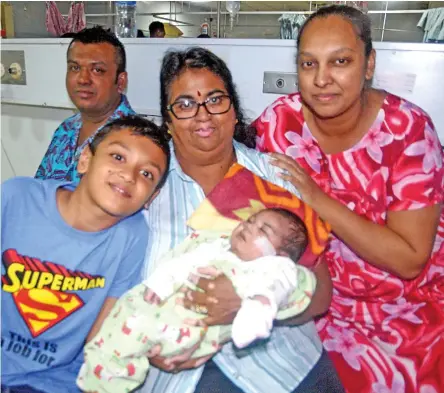  ?? Photo:Vilimoni Vaganalau ?? From left: Father Dhirendra Kishore, brother Trineth Krishen Kishore, grandmothe­r Anita Wati, baby Yuvraj Krishen Kishore, and mother Rabina Kumar at the CWM Hospital on April 18, 2017.