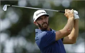  ?? ADAM HUNGER — THE ASSOCIATED PRESS ?? Dustin Johnson tees off on the second hole during final- round play at The Northern Trust golf tournament on Sunday in Old Westbury, N. Y.