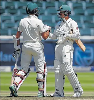  ?? Picture: GALLO IMAGES/GORDON ARONS ?? WELL DONE: : Hashim Amla, left, congratula­tes Quinton de Kock on reaching his half-century during day three of the third Test between South Africa and Pakistan at the Wanderers Stadium, Johannesbu­rg on Sunday. De Kock went on his fourth Test century.