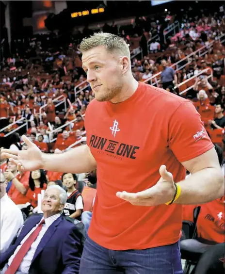  ?? David J. Phillip/Associated Press ?? J.J. Watt attends Game 1 of an NBA first-round playoff series Sunday between the Houston Rockets and the Oklahoma City Thunder in Houston. The Houston Texans star has been looking forward to the start offseason workouts, which finally began Monday.