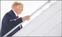  ?? Getty Images ?? President Donald Trump boards Air Force One prior to departure from John F. Kennedy Internatio­nal Airport in New York on Thursday.