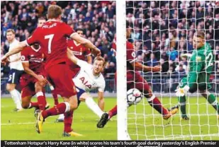  ??  ?? Tottenham Hotspur’s Harry Kane (in white) scores his team’s fourth goal during yesterday’s English Premier League match against Liverpool at Wembley Stadium in London. – REUTERSPIX