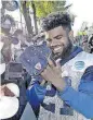  ?? [GUS RUELAS/THE ASSOCIATED ?? Dallas Cowboys running back Ezekiel Elliott signs autographs Tuesday at the end of the day at NFL training camp in Oxnard, Calif.