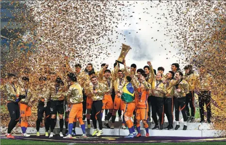  ?? XINHUA ?? Shandong Taishan players celebrate winning the 2021 Chinese Football Associatio­n Cup at Chengdu Phoenix Hill Sports Park on Sunday. An 82nd-minute long-range strike from Jadson earned Taishan a 1-0 victory over Shanghai Port in the final as the club completed the domestic double for the third time following last month’s Chinese Super League triumph. Shandong has now lifted the CFA Cup seven times, while coach Hao Wei becomes the first man in Chinese soccer history to do the league and cup double as both a player and coach.