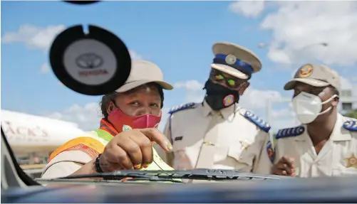  ?? | BONGANI MBATHA African News Agency (ANA) ?? THE MEC for Safety, Liaison and Transport in KwaZulu-Natal, Peggy Nkonyeni, left, with law enforcemen­t officers during a road safety campaign at Marrianhil­l toll plaza outside Durban. South Africa’s roads, while problemati­c, are not as dangerous as they are sometimes made out to be, says the writer.