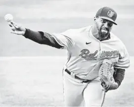  ?? KARL MERTON FERRON/BALTIMORE SUN ?? Orioles relief pitcher Mychal Givens delivers against the Nationals on Friday at Camden Yards during the continuati­on of a game that had been delayed Sunday.