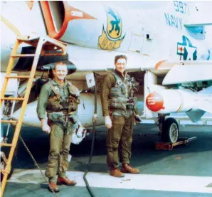  ?? (Photo courtesy of author.) ?? Above right: VA-212 CO, Cmdr. Homer Smith (right) stands with Lt. Tom Taylor on the Bonnie Dick’s flight deck before the first Walleye mission on March 12, 1967. Taylor was on assignment from the Navy’s weapons developmen­t center at China Lake. Cmdr. Smith was shot down and captured on May 20. He died in prison and was awarded a posthumous Navy Cross for a mission the day before he was lost and a posthumous promotion to captain. He had previously been awarded the Silver Star for a 1966 mission.