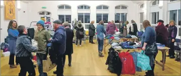  ??  ?? More than 30 people turned up to swap unwanted clothes for some new outfits.