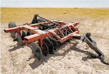  ?? — AFP ?? A view of a plough in a dried-up agricultur­al field in the Saadiya area, north of Diyala in eastern Iraq.