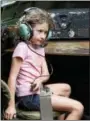  ?? DIGITAL FIRST MEDIA FILE PHOTO ?? In this 2013 file photo, Mirielle Sherman pretends to talk to the pilot from the radio operator’s position in a B-17 Flying Fortress at the Wings of Freedon tour at the Chester County Airport in Valley Township.