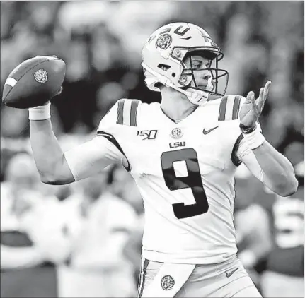  ?? KEVIN C. COX/GETTY ?? Joe Burrow completed 31 of 39 passes and added 64 rushing yards as the Tigers beat the Crimson Tide for the first time since 2011.