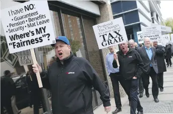  ?? MICHELLE BERG ?? Business owners in Saskatoon rallied on Thursday against proposed federal tax changes that they say will hinder business growth and cost Canada jobs.