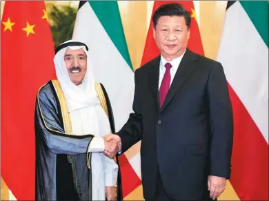  ?? LI XUEREN / XINHUA ?? President Xi Jinping greets Kuwaiti Emir Sheikh Sabah Al-Ahmad Al-Jaber Al-Sabah at the Great Hall of the People in Beijing on Monday. The two countries agreed to establish a strategic partnershi­p.