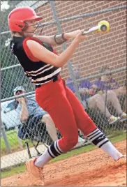  ?? Gail Conner ?? Cedartown’s Taylor Westmorela­nd connects with the ball during Game 1 of the first round series against Hampton on Tuesday, Oct. 12.