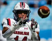  ?? AP PHOTO BY NELL REDMOND ?? In this Aug. 31, 2019, file photo, South Carolina running back Deshaun Fenwick warms up prior to an NCAA college football game against North Carolina in Charlotte, N.C.