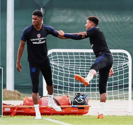  ??  ?? Stretch: England’s Marcus Rashford (left) and Jesse Lingard at a training session in St Petersburg yesterday. Inset: England manager Gareth Southgate. —