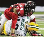  ?? CURTIS COMPTON / CCOMPTON@AJC.COM ?? Falcons defensive end Vic Beasley, sacking Packers star Aaron Rodgers, led the NFL with 15.5 sacks in 2016 and forced six fumbles.