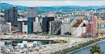  ?? RICK STEVES/RICK STEVES’ EUROPE ?? The “Barcode Project,” a collection of high-rises built on former industrial land, has reshaped Oslo’s skyline.